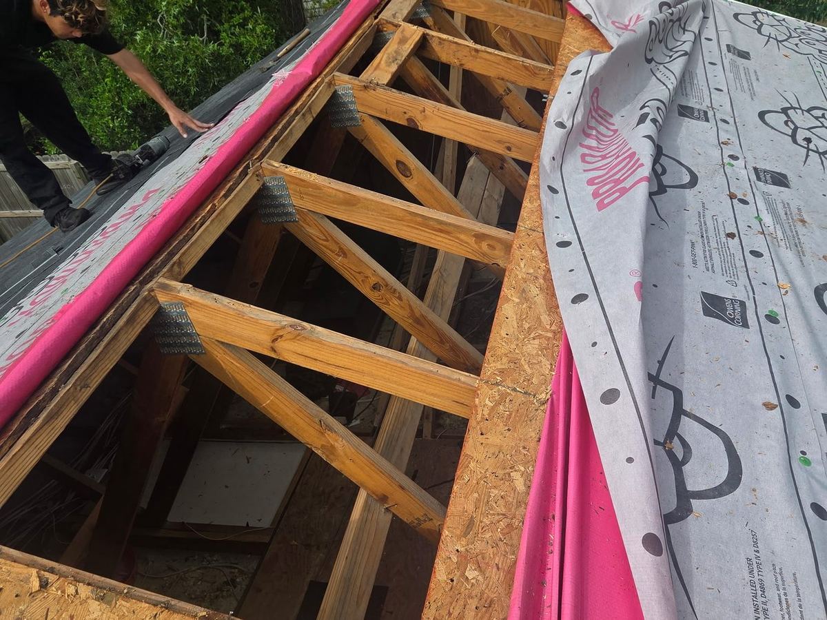 Crew cutting in the ridge vent on a re-roof in Jacksonville NC