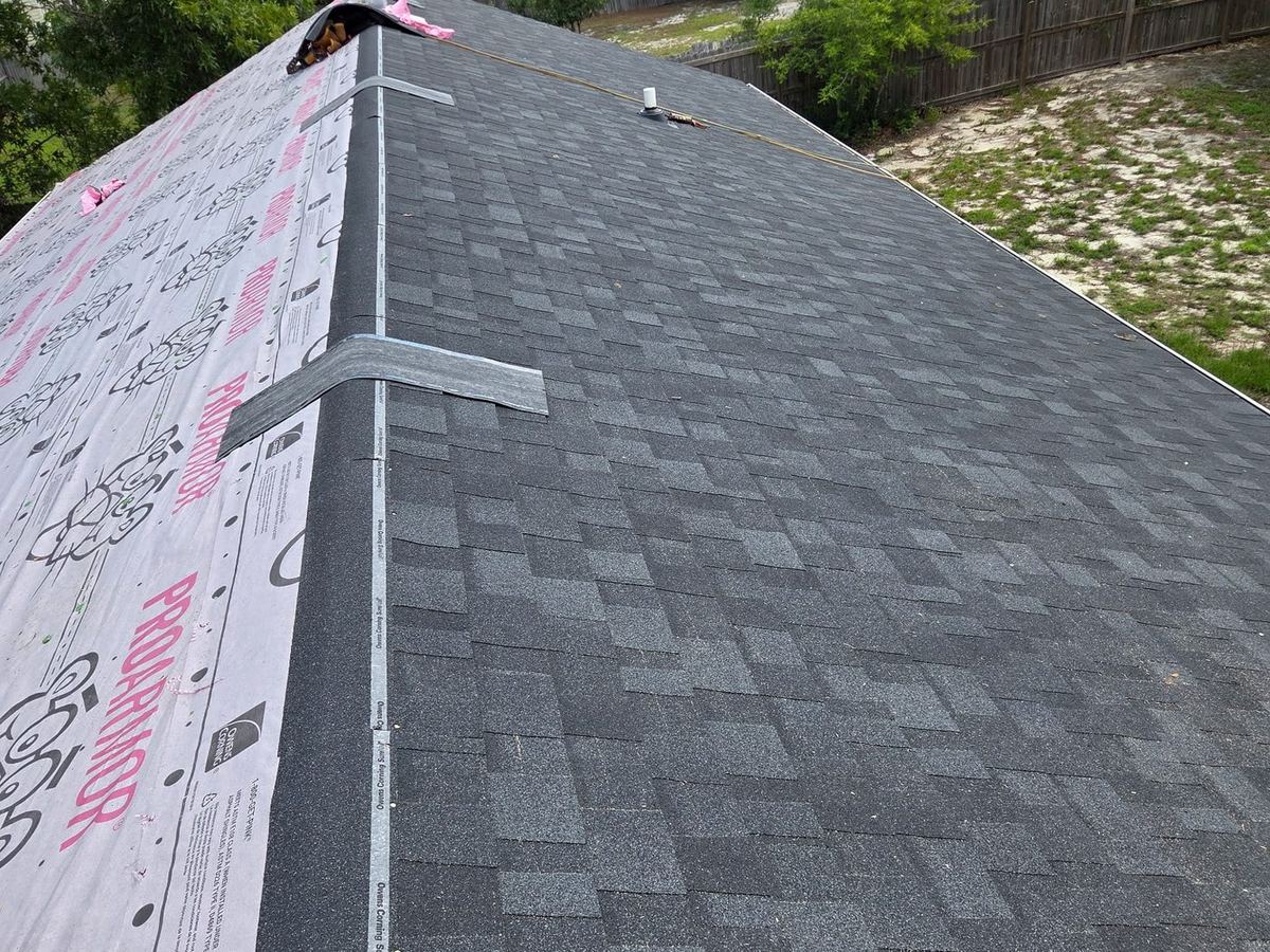 Completed architectural shingle roof with new ridge cap, Jacksonville NC